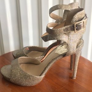 Vince Camuto metallic gold strap heeled sandals.
